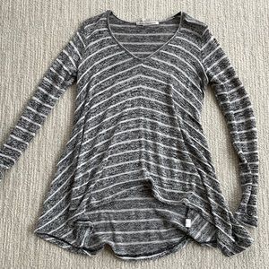 Lightweight striped sweater. Shorter in front and longer in back